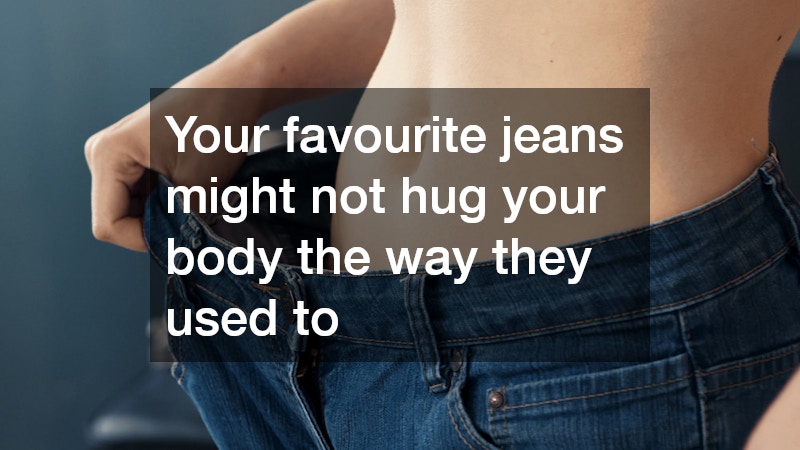 close-up view of loose jeans being stretched at the waist